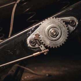 Recliner release cable unhooked from the ratchet mechanism under the chair