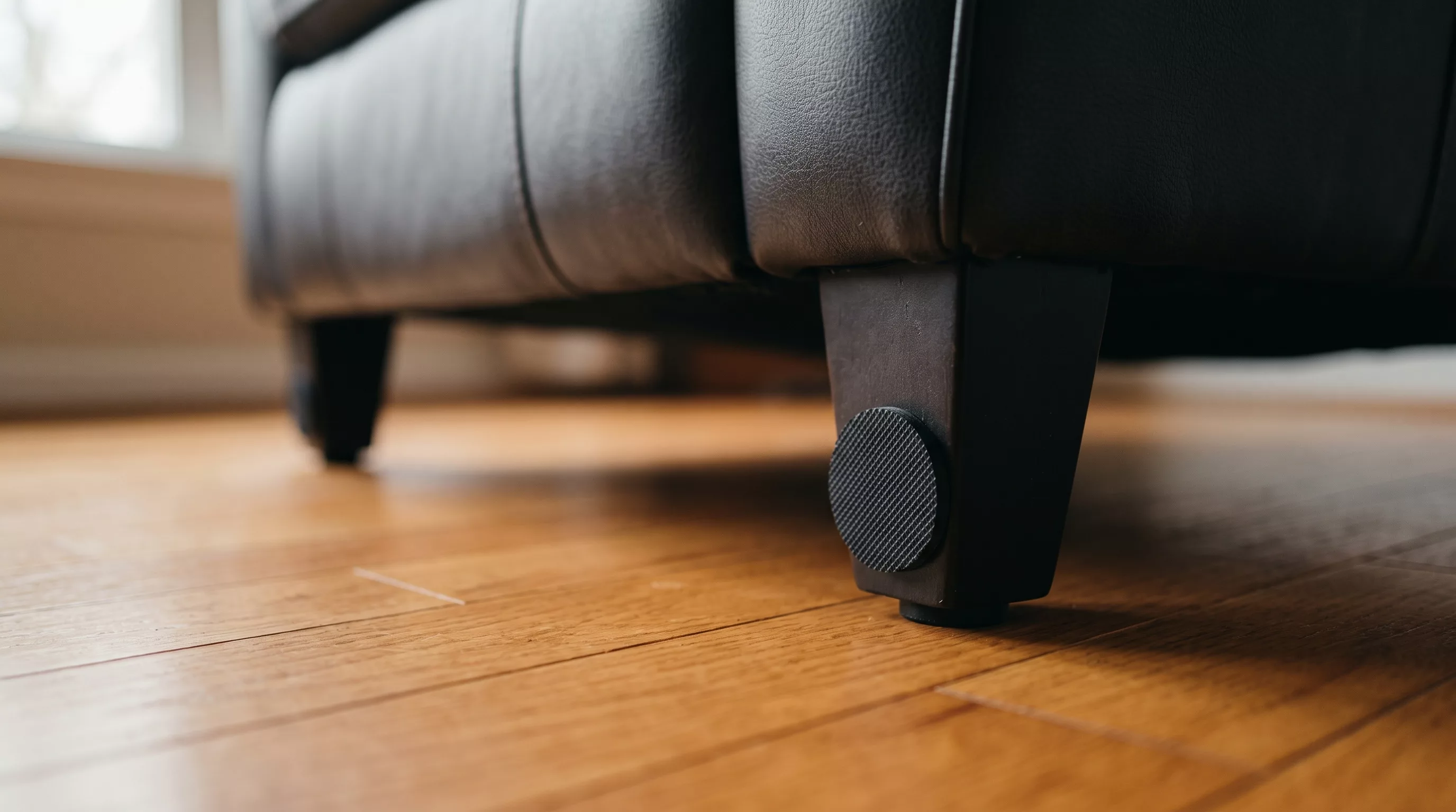 Rubber furniture grippers on the legs of a recliner