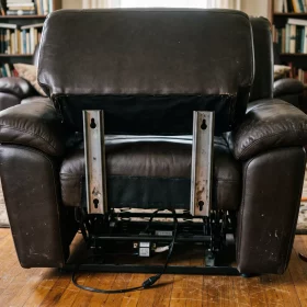 How to disassemble a recliner by releasing the back off its brackets