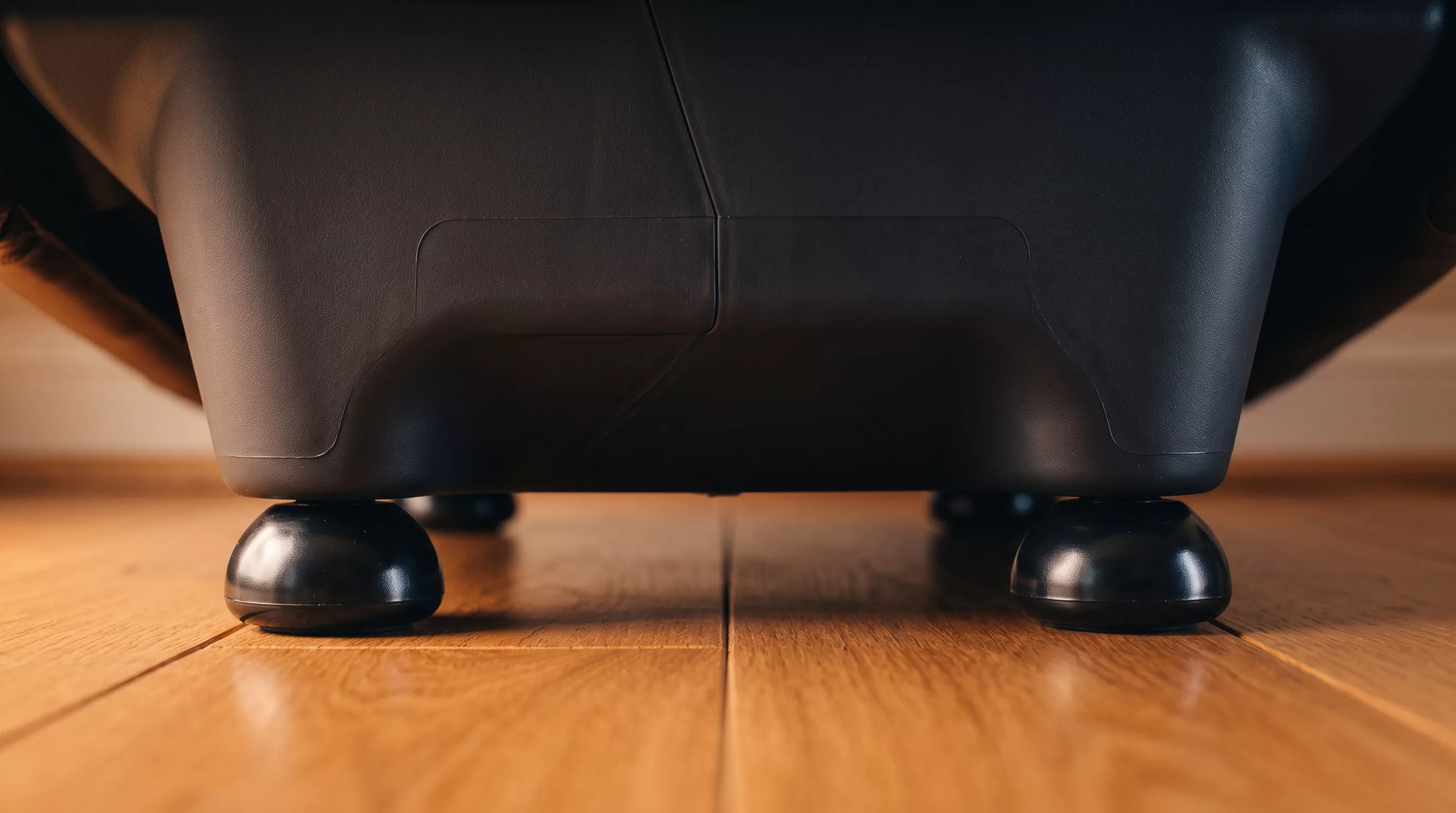 Recliner sliding on a hardwood floor from the recline motion pushing the base
