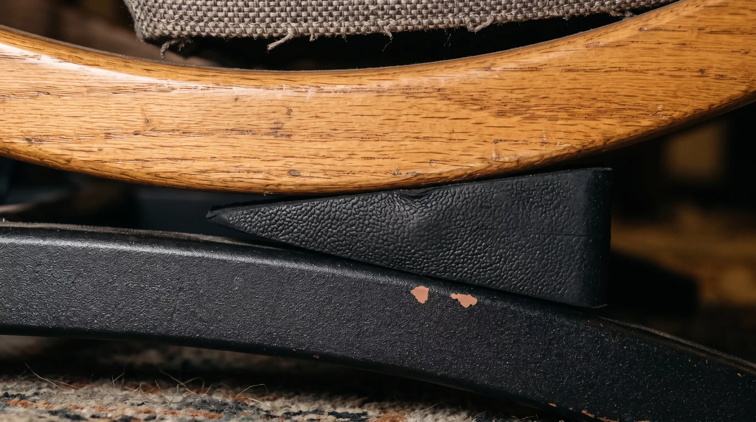 A stop block wedged under the rocker rail of a recliner