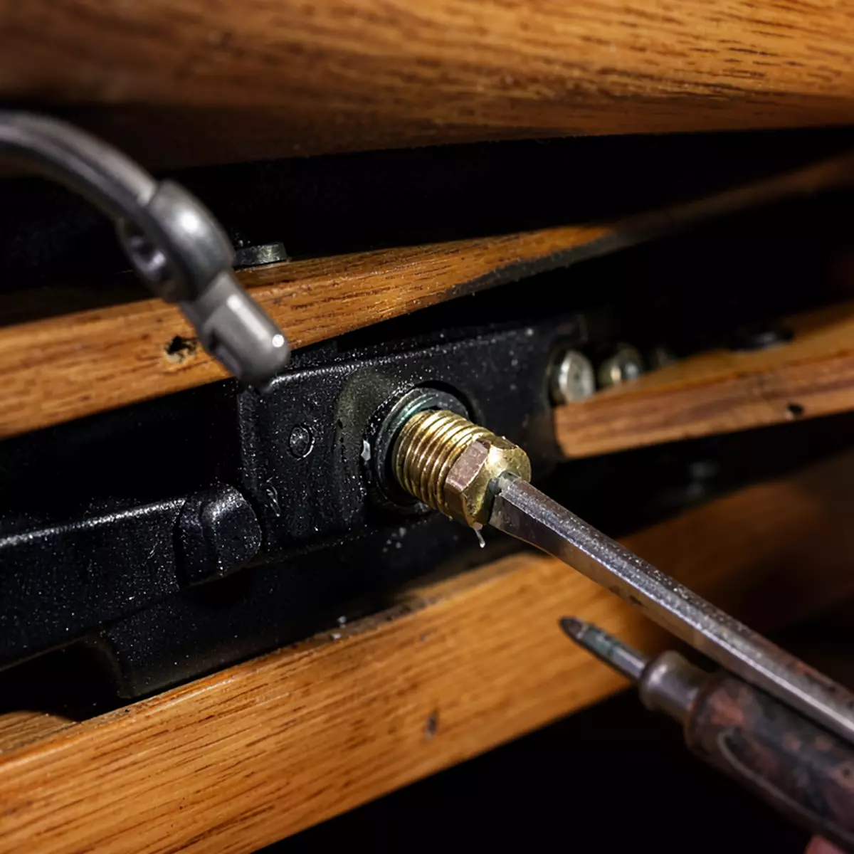 adjusting recliner tension and tightening the seat bolts