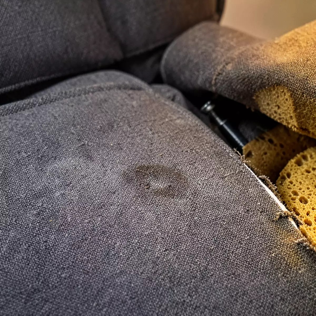 worn recliner before reupholstering